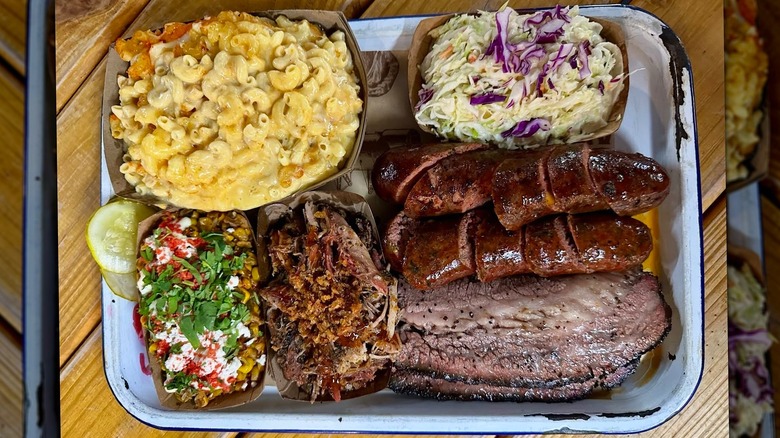 A tray of meats and sides from 2Fifty Texas BBQ