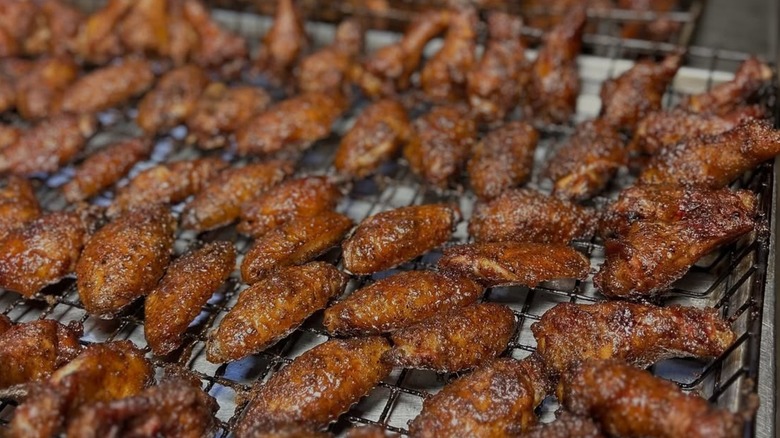 Chicken wings on a rack at The Shed Barbeque & Blues Joint
