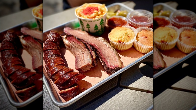 A platter of meats and sides from Wild Fig BBQ Takeout & Catering