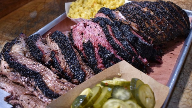 A platter of brisket and sides from Red White & Que Smokehouse