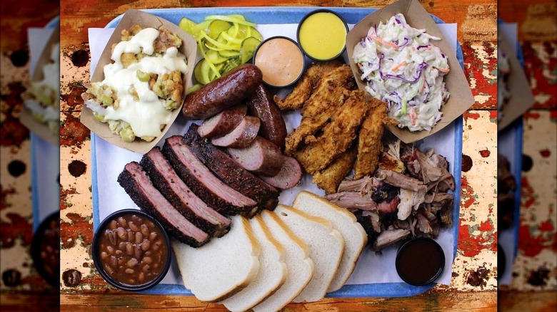 A platter of meats and sides from NoBull Smokehouse