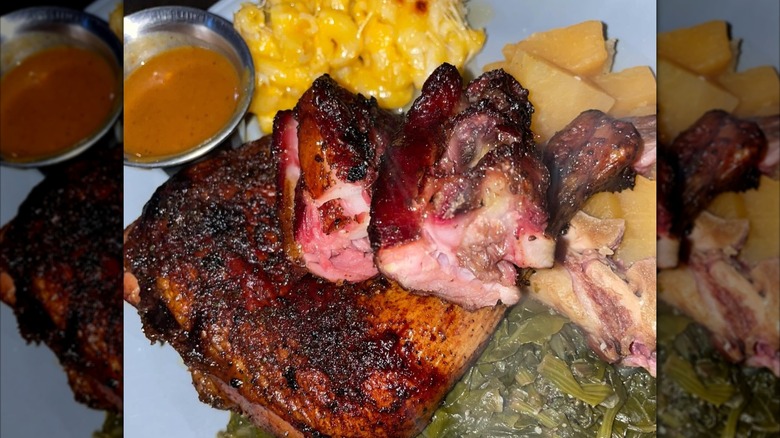 A plate with smoked chicken and sides from South Dakota: Southern Perfection BBQ LLC in Sioux Falls