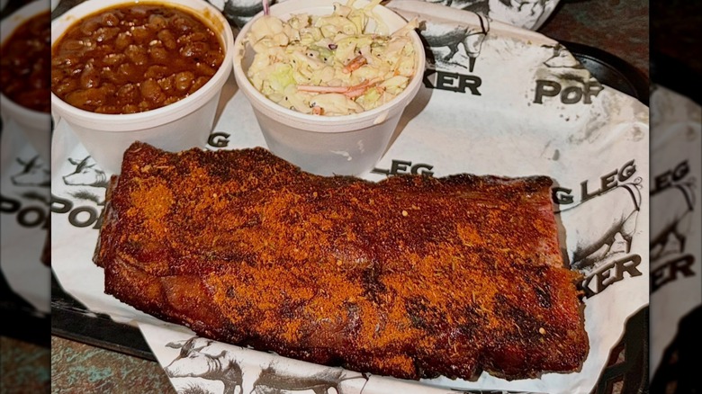 A platter of ribs and sides from Peg Leg Porker BBQ