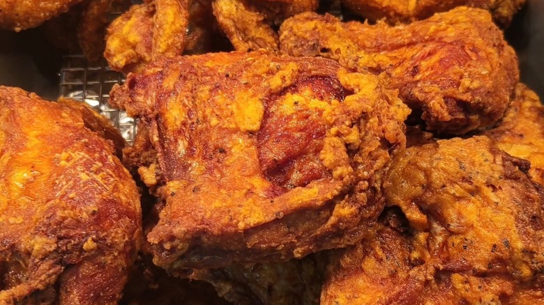 Close-up of fried chicken on metal grate