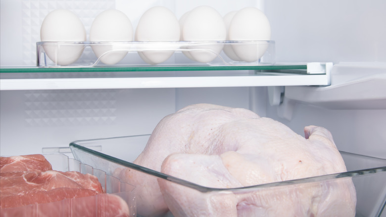 raw chicken in a refrigerator 