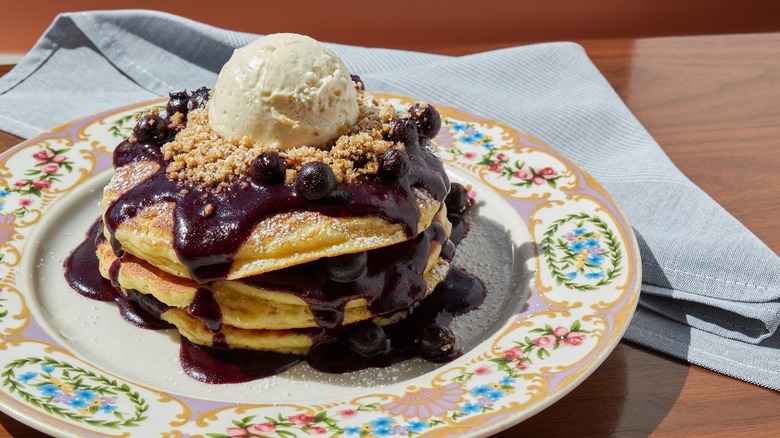 A plate of blueberry pancakes at Unconventional Diner