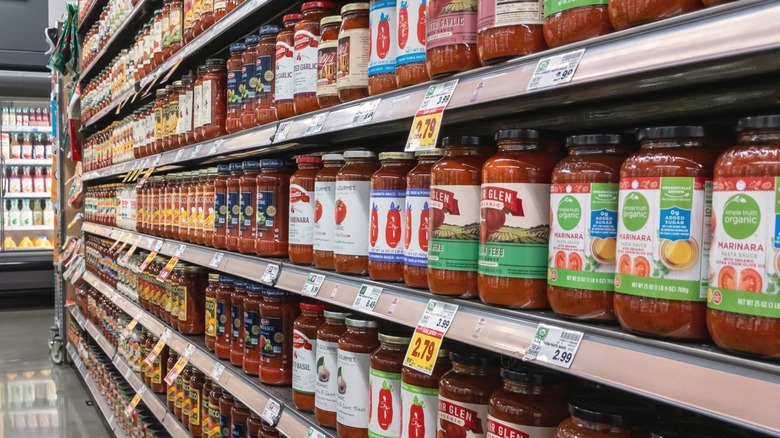 Jars of marinara sauce on store shelf