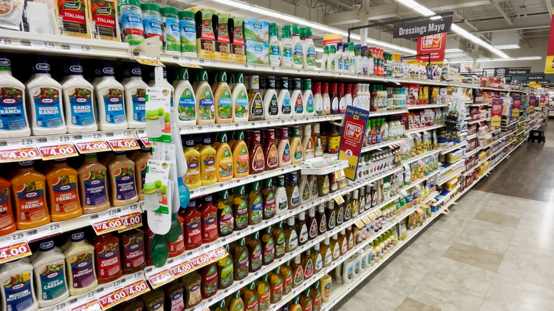 Grocery store aisle with bottles of ranch and other salad dressings