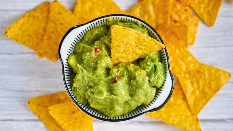 Tortilla chips with a bowl of guacamole