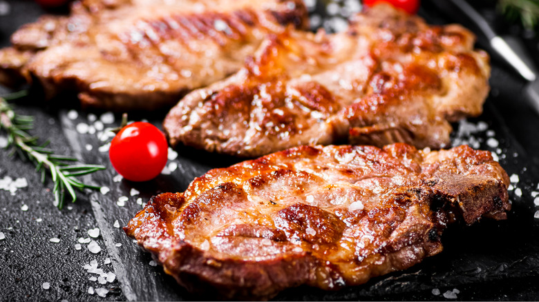 Pork steaks with tomatoes.