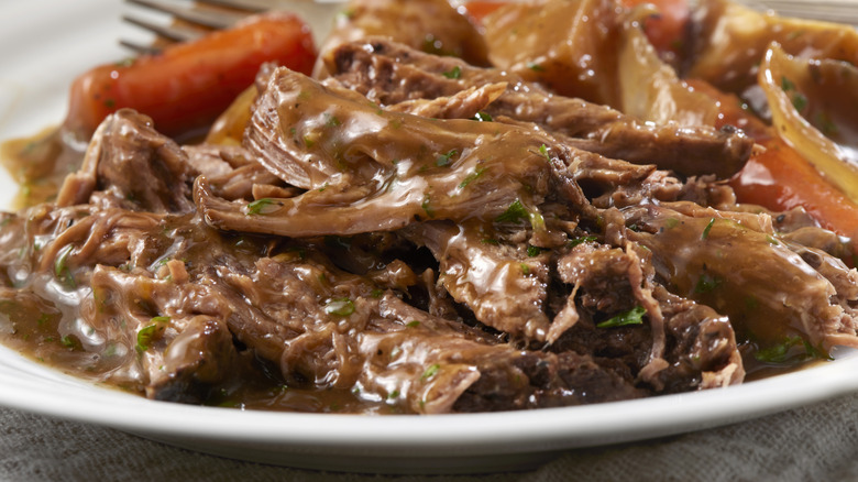 Close up of chuck roast with gravy.