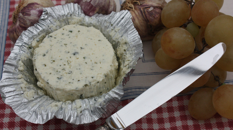 unwrapped round of herb-infused boursin cheese