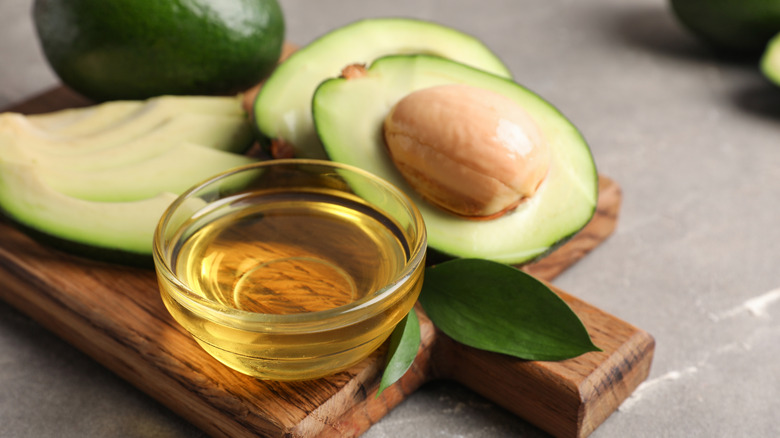 cut open avocado and oil