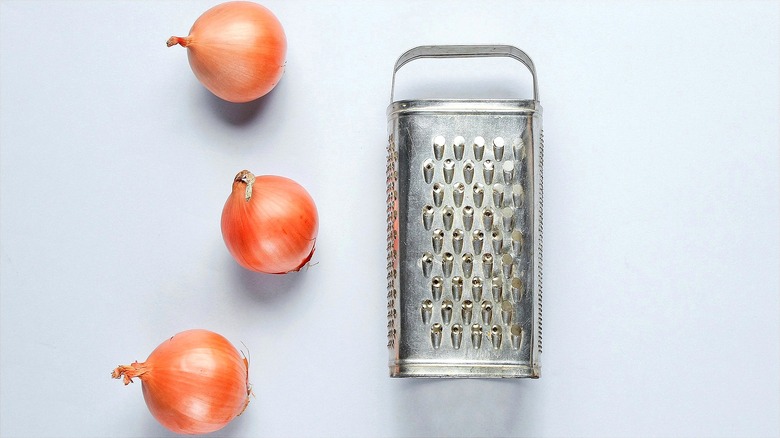 Three whole yellow onions