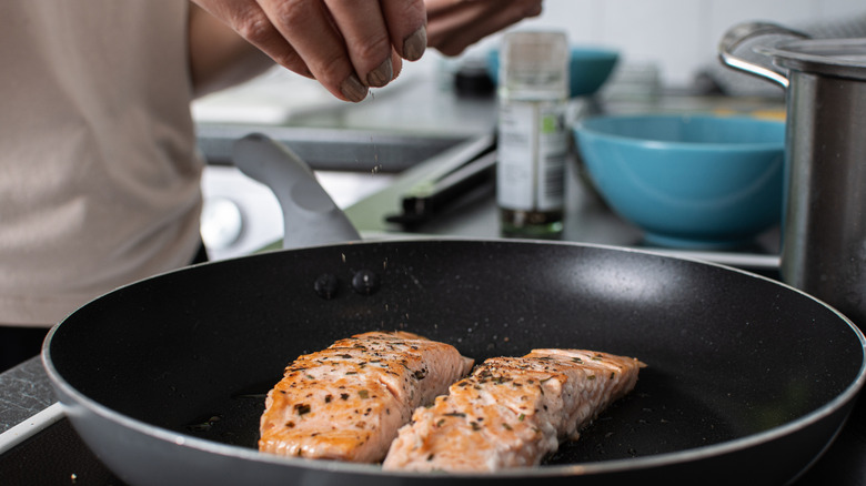 Cooking salmon in pan