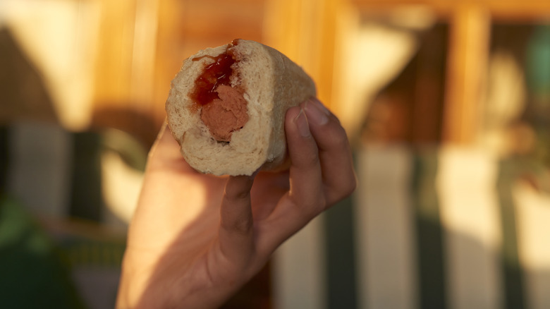 Hot dog topped with ketchup