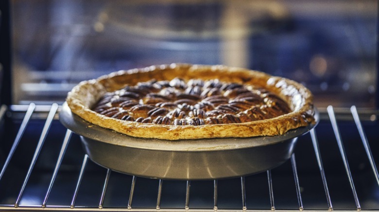 pecan pie baking in the oven
