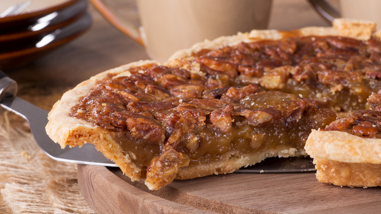 Serving sliced pecan pie