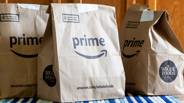 Whole Foods grocery delivery bags with Amazon Prime logo on them