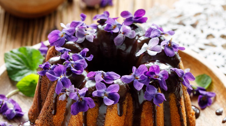violets on top of chocolate bundt cake