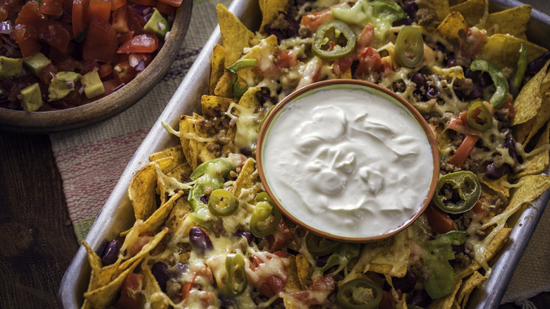 Nacho platter with sour cream