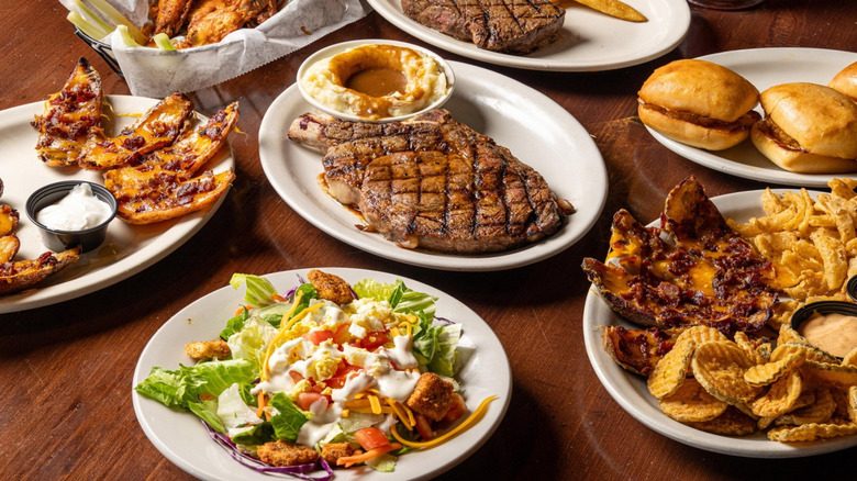 An array of Texas Roadhouse dishes on a table