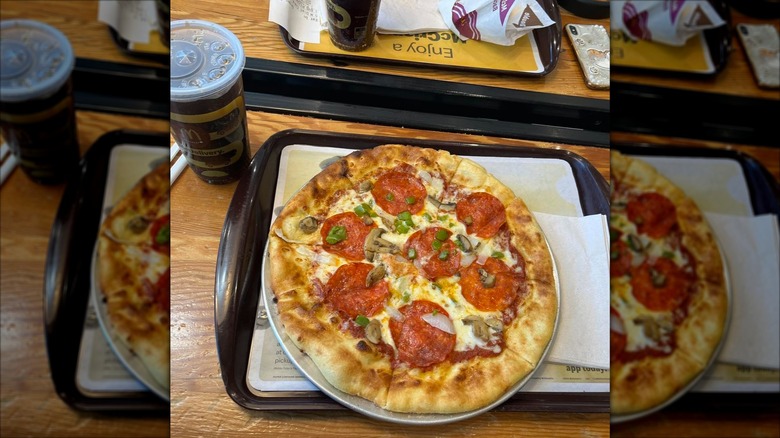 A pepperoni and mushroom pizza from the world's largest McDonald's on a tray