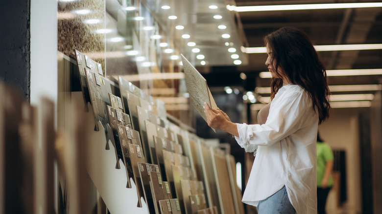 woman picking out tile options