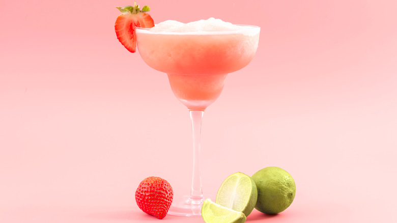 frozen strawberry margarita glass with lime