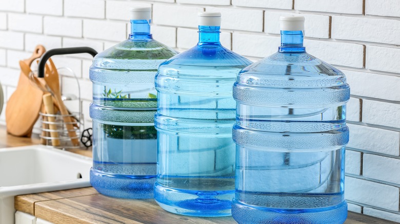 large water bottles on kitchen counter 