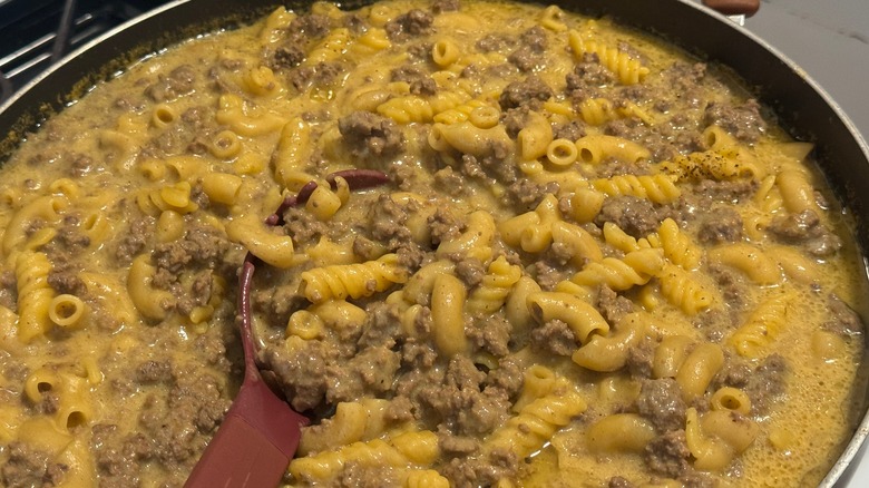 Hamburger Helper cooking in a dish