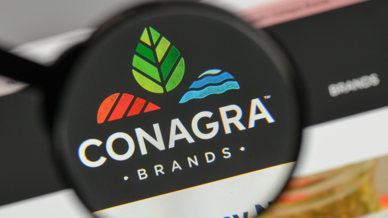 a magnifying lens focused on ConAgra Brands logo