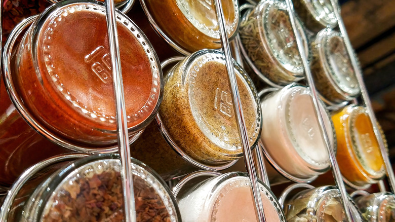 View from the bottom of spice jars on a shelf