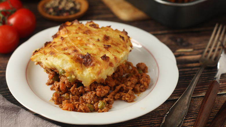 A slice of shepherd's pie on a white plate