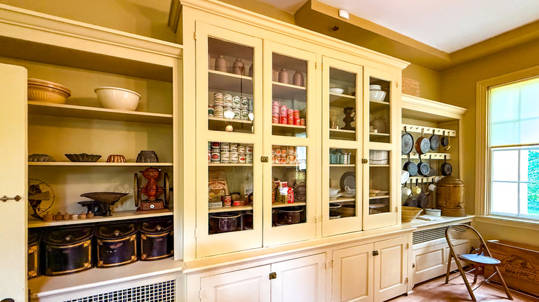 Kitchen farmhouse cabinet with glass windows.