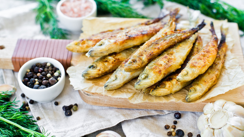 Fried smelt on wooden boared