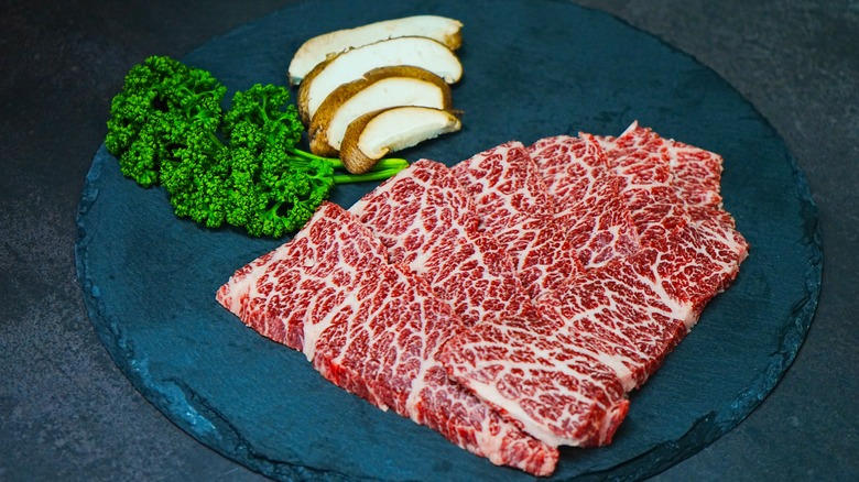 Uncooked chuck flap steak.