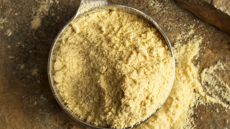 butter powder in a metal cup