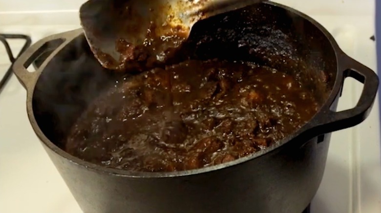 Cajun gravy cooking on a stove
