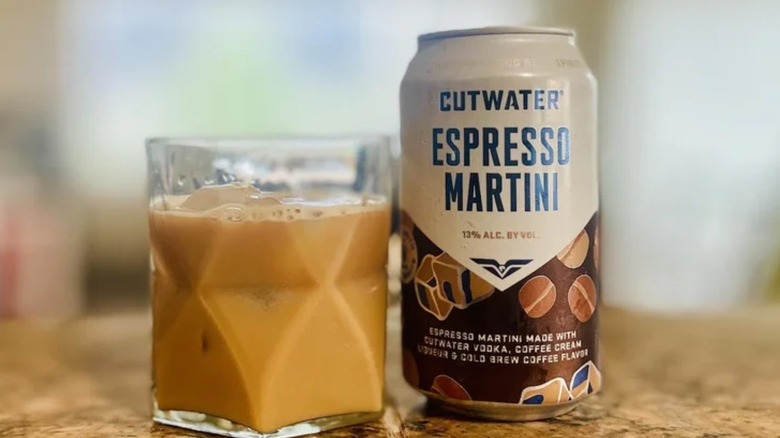 a can of cutwater espresso martini next to a glass