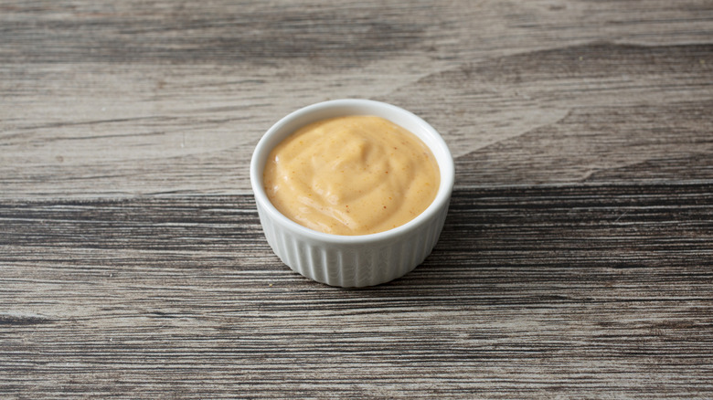 A pale, creamy, sauce in a small bowl