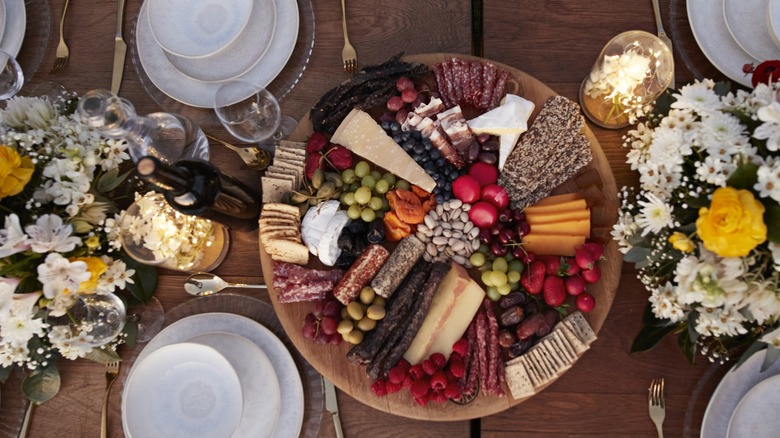 A circular charcuterie board on a table