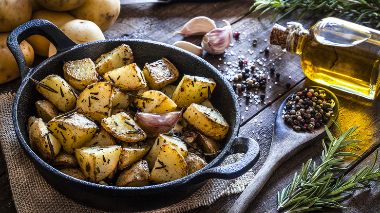 cast iron pan filled with roasted potatoes