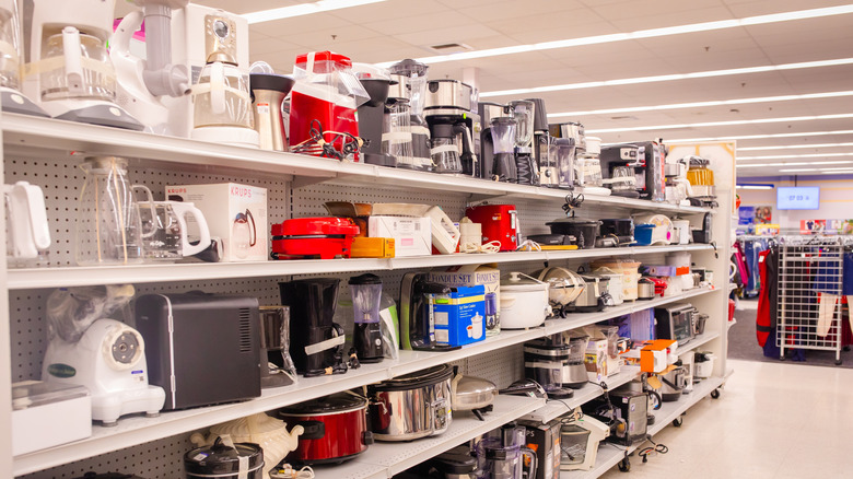Kitchenware is seen on thrift store shelves.