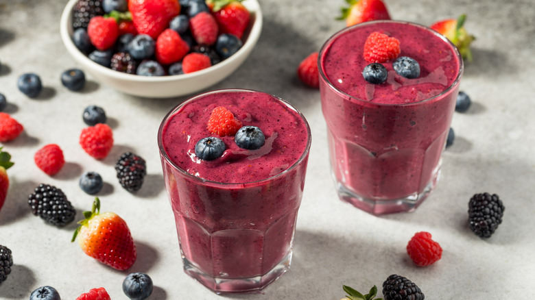 Two smoothies with mixed berries