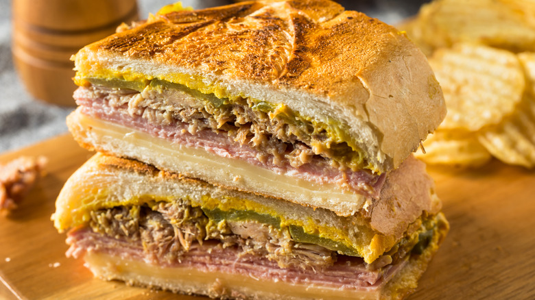 A close up of a halved Cuban sandwich