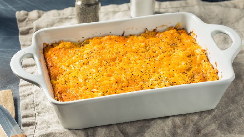 A cheesy casserole in a white dish
