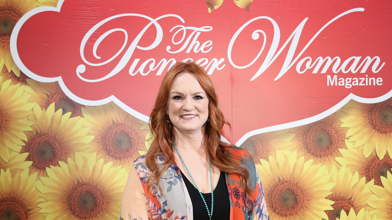 Ree Drummond posing in front of a backdrop