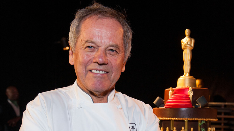 Chef Wolfgang Puck smiles at an Oscars event