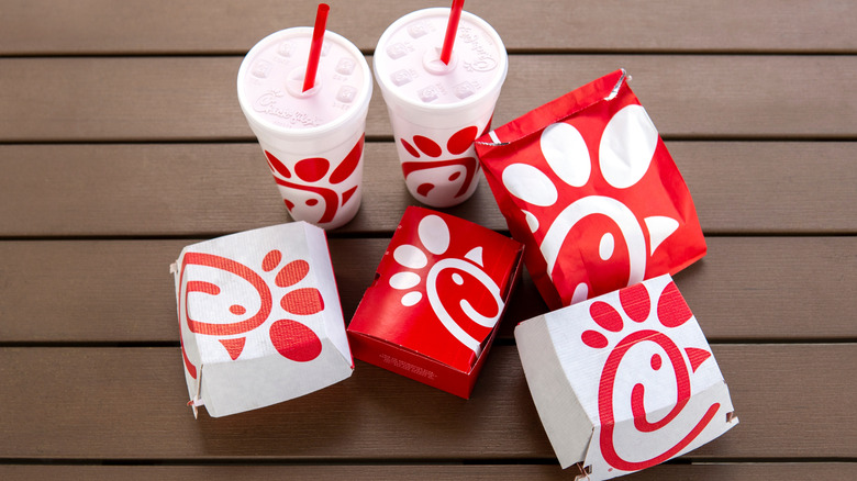 Chick-fil-A food boxes and drink cups on a table